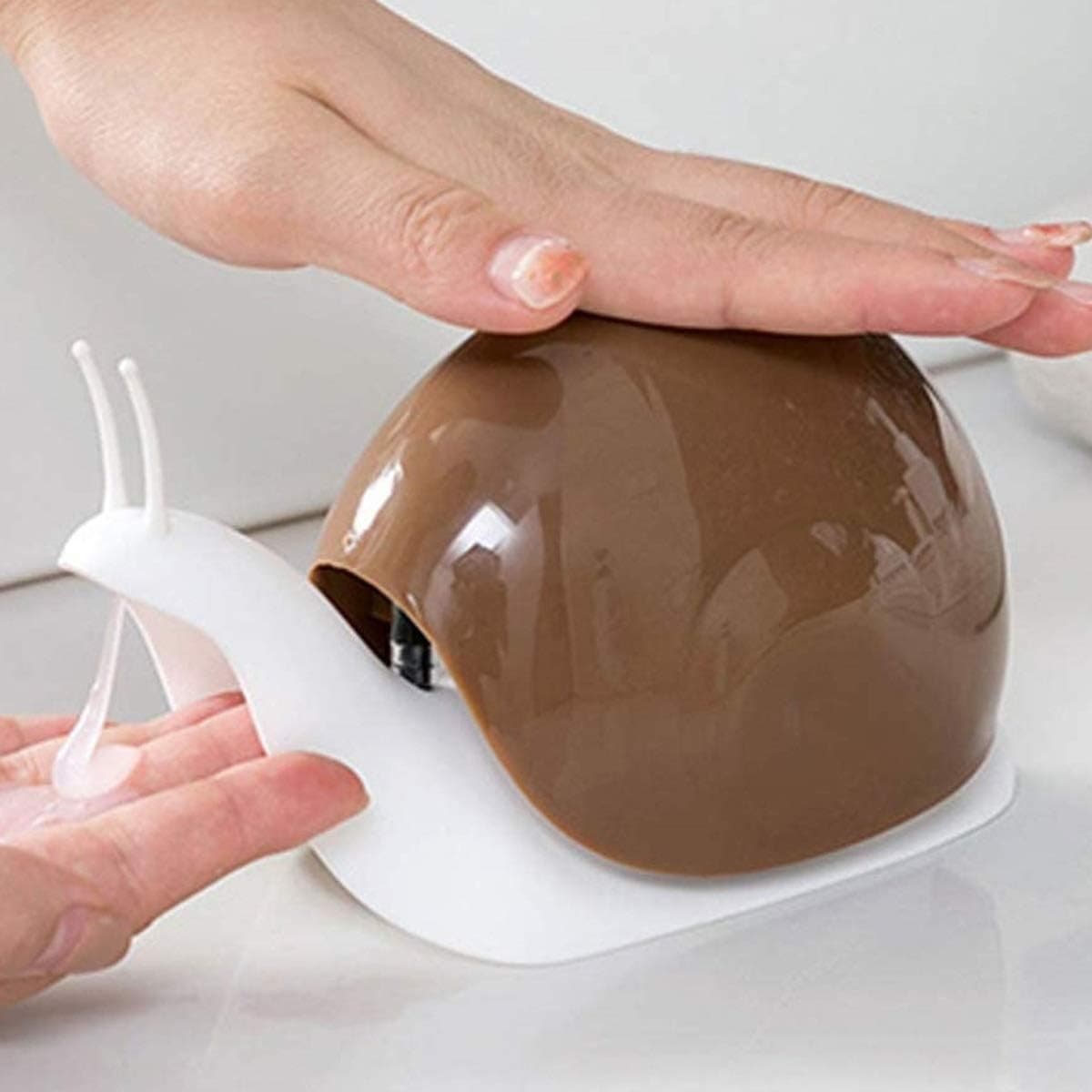 Brown snail-shaped TabEnter countertop soap dispenser