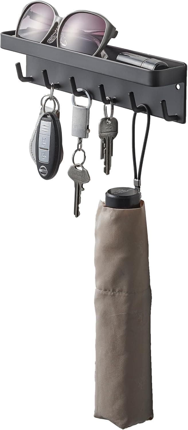 Black Yamazaki Home magnetic key rack with hooks and a top tray